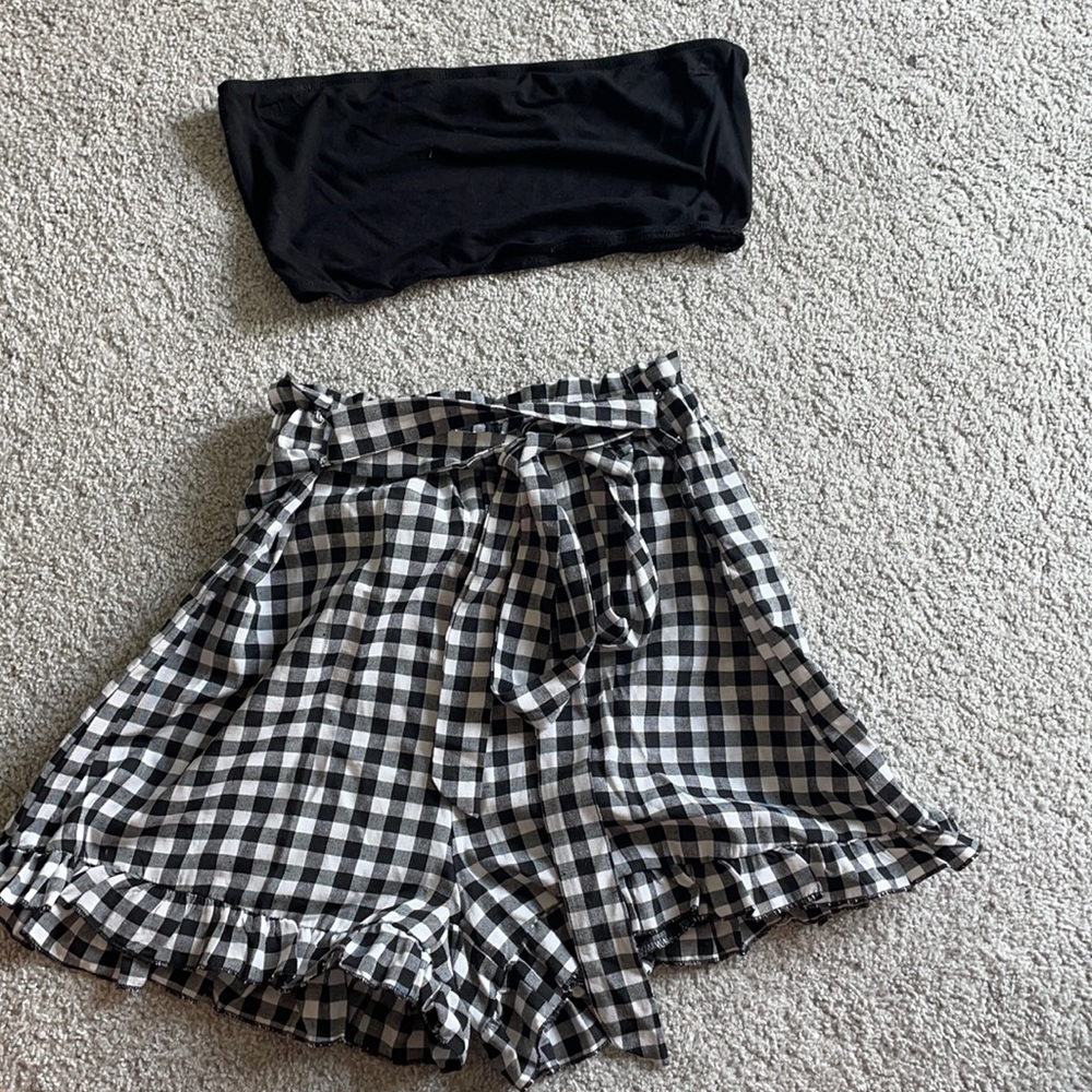 black tube top and checkered shorts